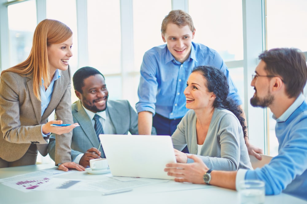 executives-joking-laughing-office (1)-min